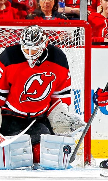 Devils lock up goalie Schneider with seven-year, $42 million extension